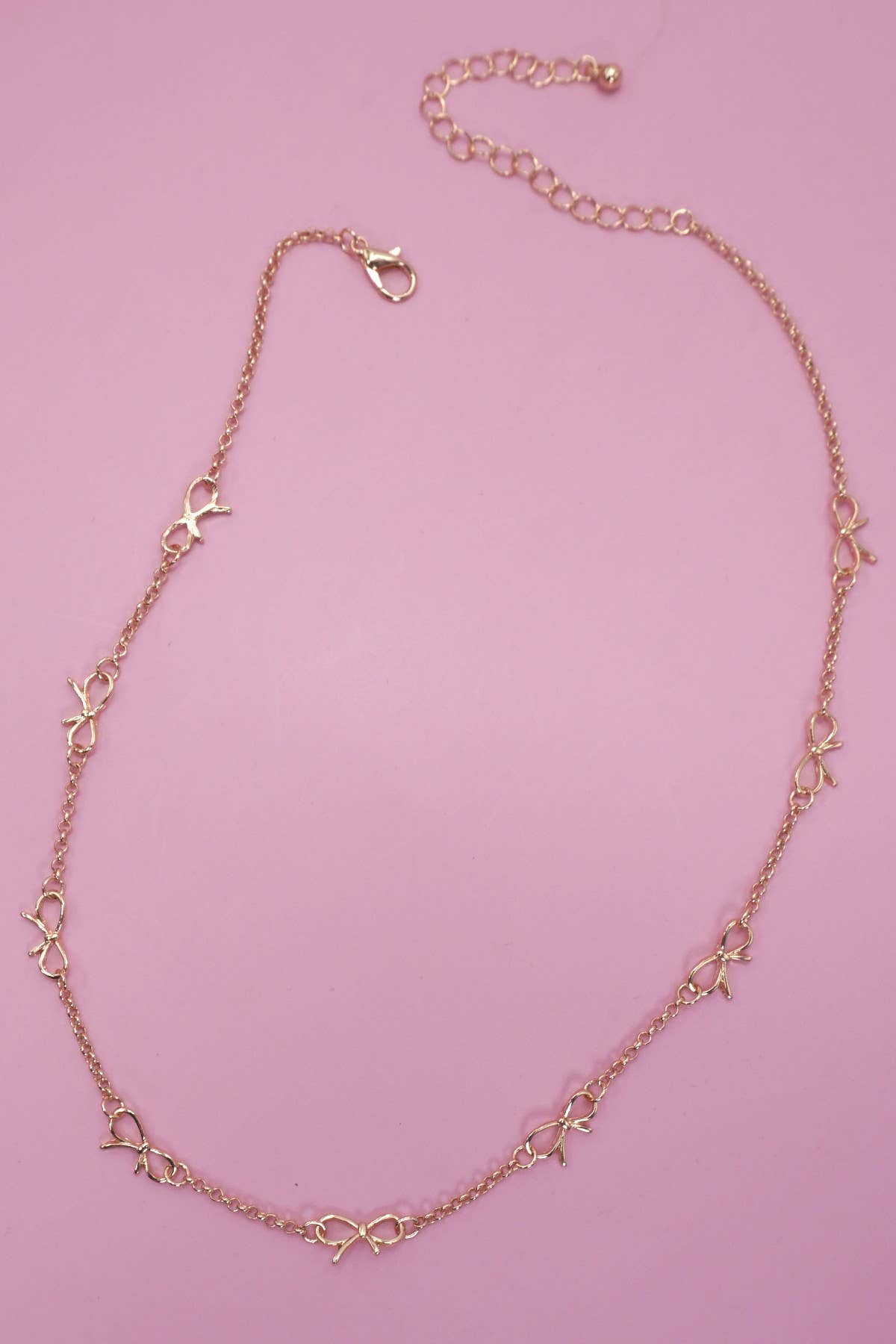 CUTOUT BOW STATION NECKLACE |