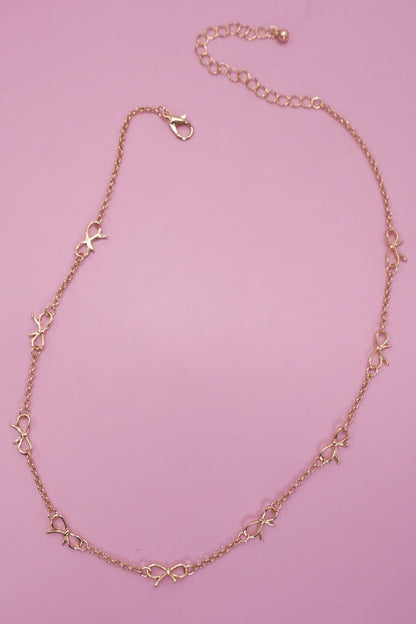 CUTOUT BOW STATION NECKLACE |