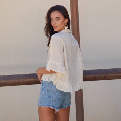 Distressed Denim Crop Jacket with Ruffled Hem