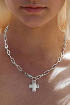 JOSSLYN by wall to wall - NOTABLE HAMMERED CROSS FRONT TOGGLE NECKLACE |