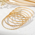 JOSSLYN by wall to wall - Gold Layered Bangle Set - Mixed Texture Stack |