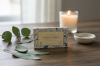 Box of Magnolia Home products on a wooden surface