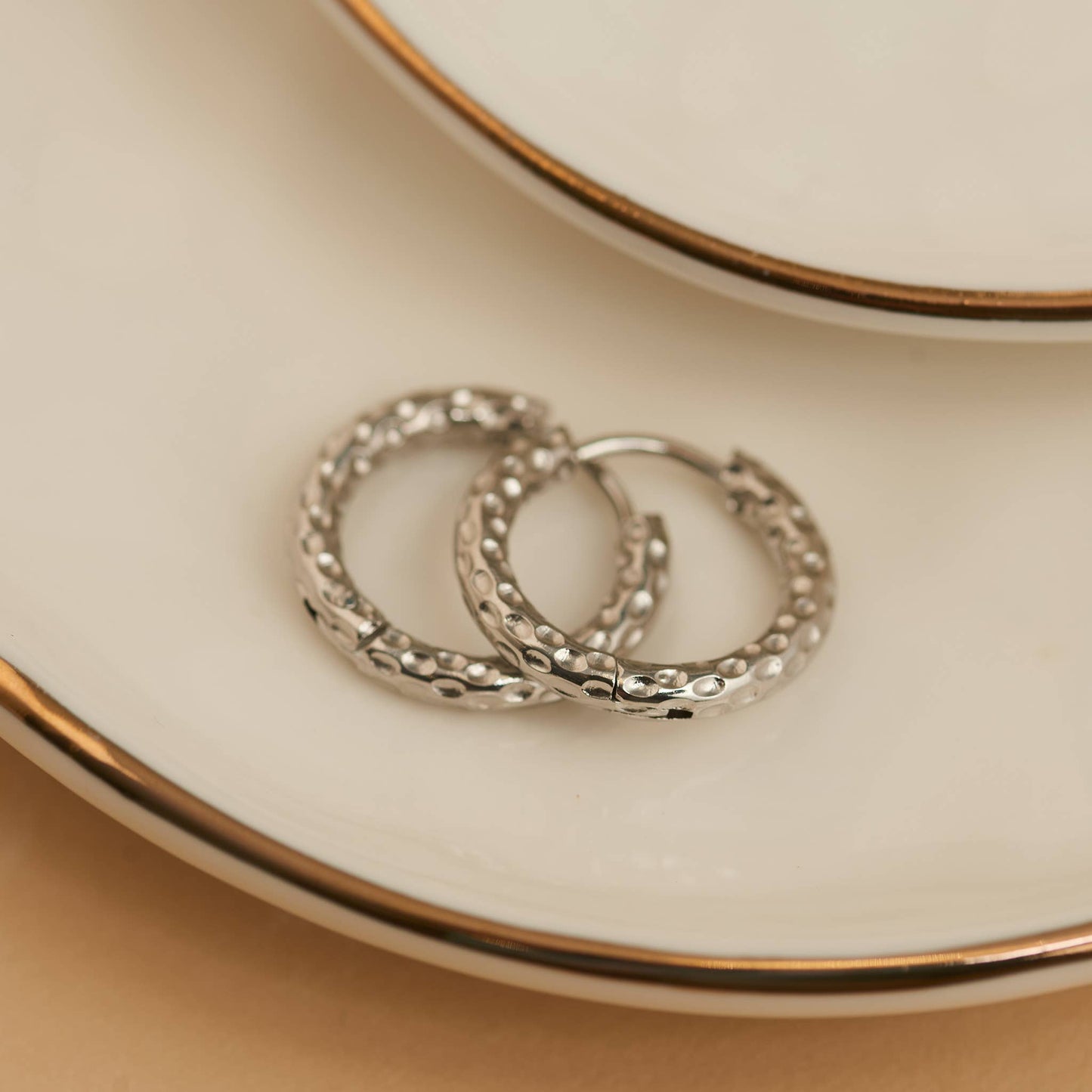 Howard's - Waterproof Earrings Hammered Huggie Hoop in Gold & Steel