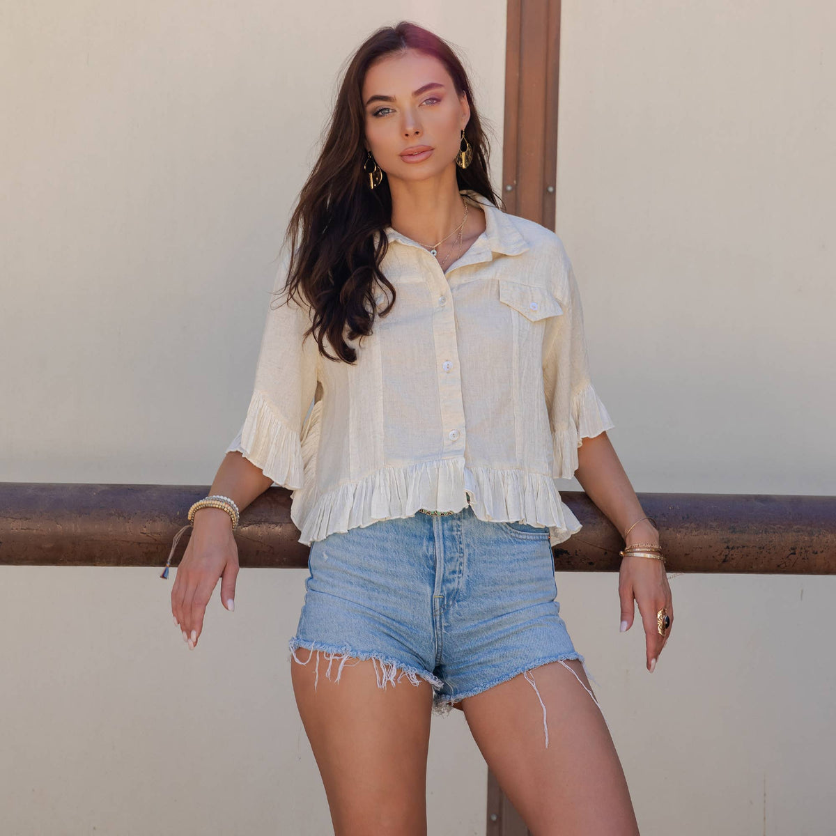 Distressed Denim Crop Jacket with Ruffled Hem