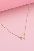 MINI GOLD BOW CHARM NECKLACE |