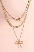 MULTI LAYER PEARL BOW CAHRM NECKLACE |