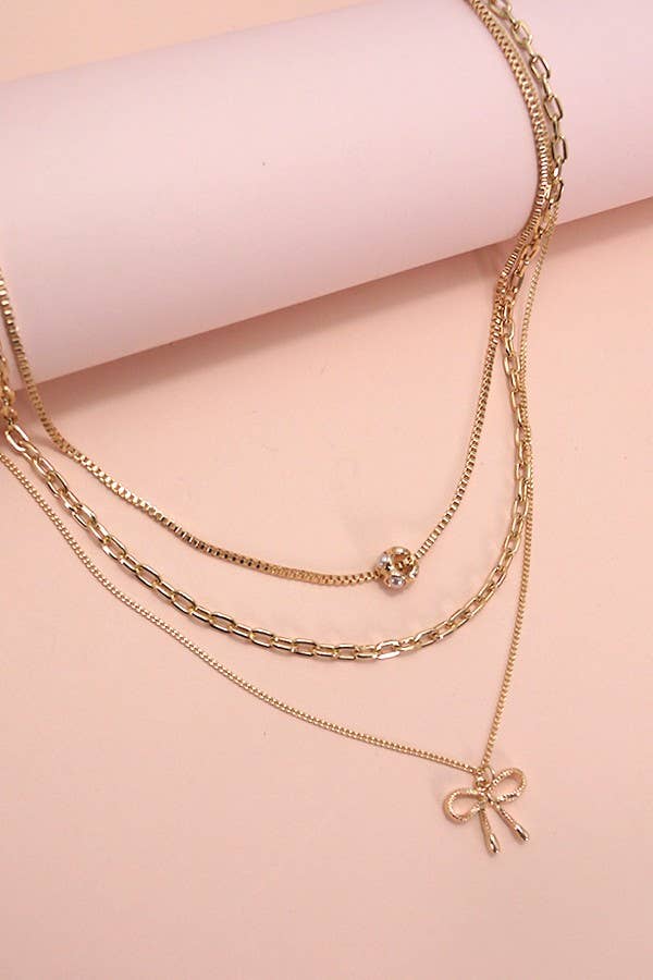 MULTI LAYER PEARL BOW CAHRM NECKLACE |