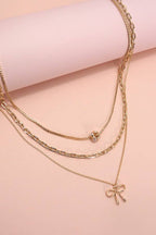 MULTI LAYER PEARL BOW CAHRM NECKLACE |