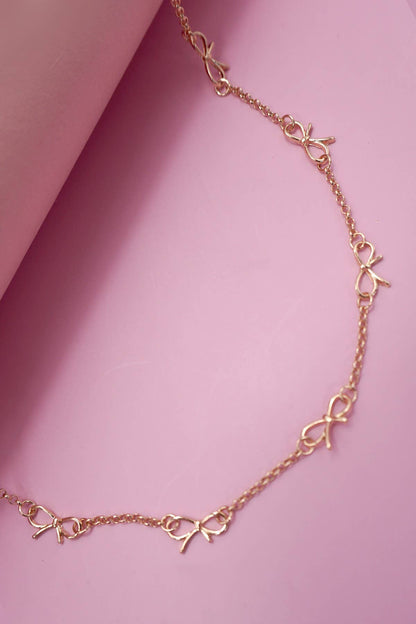 CUTOUT BOW STATION NECKLACE |